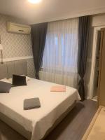 Postel nebo postele na pokoji v ubytování antik sofia hotel