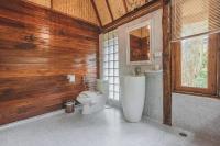 a bathroom with a toilet and a sink at Banyan Bay Villas in Ko Jum