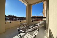 3 Stühle auf einem Balkon mit einem großen Fenster in der Unterkunft Stunning 1 BR 3 pers Résidence Cannes Suquet Vieux Port Croisette 1 mn by Olam Properties in Cannes