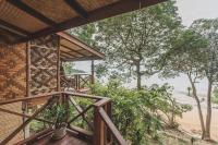 a view from the deck of a house with trees at Banyan Bay Villas in Ko Jum