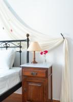 A bed or beds in a room at Reggina's Apartments