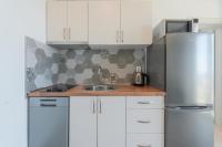 Kuchyňa alebo kuchynka v ubytovaní Apartments Mrkan