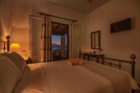 A bed or beds in a room at Reggina's Apartments