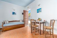 A bed or beds in a room at Reggina's Apartments