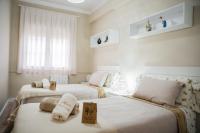 Postel nebo postele na pokoji v ubytování Gallimó Apartaments