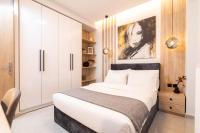Posteľ alebo postele v izbe v ubytovaní F & B Collection - City Central 2 Bedroom Suite