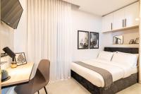 Posteľ alebo postele v izbe v ubytovaní F & B Collection - City Central 2 Bedroom Suite