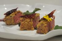 a white plate with three different types of food at Caportigia Boutique Hotel in Siracusa