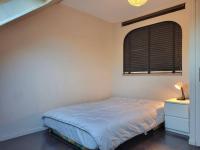 a small bedroom with a bed and a window at Appartement Merville-Franceville-Plage, 3 pièces, 6 personnes - FR-1-465-87 in Merville-Franceville-Plage