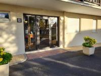 an entrance to a building with sliding glass doors at Appartement Merville-Franceville-Plage, 3 pièces, 6 personnes - FR-1-465-87 in Merville-Franceville-Plage