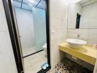 a bathroom with a sink and a shower at Junyi Landscape Villa in Ren&#39;ai