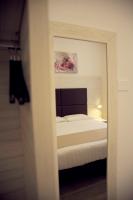 A bed or beds in a room at Hotel Fioralba
