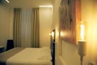 A bed or beds in a room at Hotel Fioralba