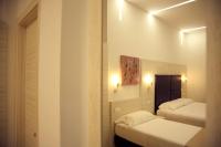 A bed or beds in a room at Hotel Fioralba
