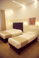 A bed or beds in a room at Hotel Fioralba