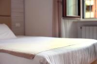 A bed or beds in a room at Hotel Fioralba
