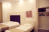 A bed or beds in a room at Hotel Fioralba