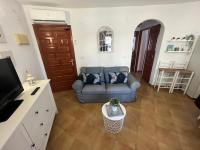 TV a/nebo společenská místnost v ubytování Apartamento Urb Oasis Park II Denia, las Marinas