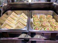 a metal tray filled with sandwiches and other food at Link World Hotel in Taipei