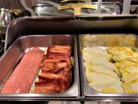a tray of food with meat and other foods at Link World Hotel in Taipei