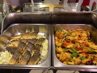 two metal trays filled with different types of food at Link World Hotel in Taipei