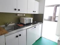 a kitchen with a sink and a microwave at Studio Piau-Engaly, 1 pièce, 4 personnes - FR-1-457-258 in Aragnouet