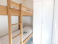 a bunk bed with a ladder in a room at Studio Piau-Engaly, 1 pièce, 4 personnes - FR-1-457-258 in Aragnouet