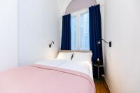 Posteľ alebo postele v izbe v ubytovaní Adagio Downtown Rooms