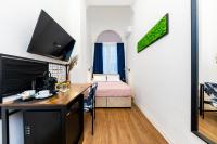 Posteľ alebo postele v izbe v ubytovaní Adagio Downtown Rooms