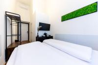Posteľ alebo postele v izbe v ubytovaní Adagio Downtown Rooms