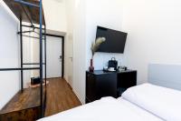 Posteľ alebo postele v izbe v ubytovaní Adagio Downtown Rooms