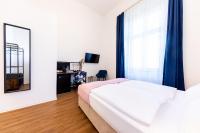 Posteľ alebo postele v izbe v ubytovaní Adagio Downtown Rooms