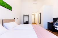 Posteľ alebo postele v izbe v ubytovaní Adagio Downtown Rooms