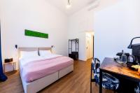 Posteľ alebo postele v izbe v ubytovaní Adagio Downtown Rooms
