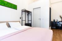 Posteľ alebo postele v izbe v ubytovaní Adagio Downtown Rooms