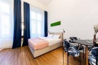 Posteľ alebo postele v izbe v ubytovaní Adagio Downtown Rooms