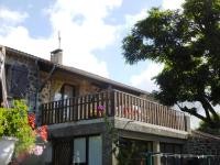 a house with a balcony on top of it at Gîte Saint-Haon, 4 pièces, 5 personnes - FR-1-582-211 in Saint-Haon