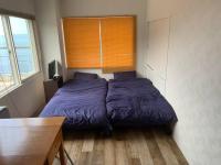 Zenibako House 3F-RoomDにあるベッド