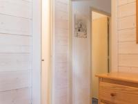 a bedroom with white walls and a wooden door at Appartement Le Monêtier-les-Bains, 2 pièces, 6 personnes - FR-1-330F-35 in Le Monêtier-les-Bains