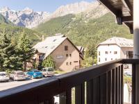 a balcony with a view of a street and mountains at Appartement Le Monêtier-les-Bains, 2 pièces, 6 personnes - FR-1-330F-35 in Le Monêtier-les-Bains