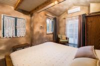 Posteľ alebo postele v izbe v ubytovaní Rustic Cozy house Pupy