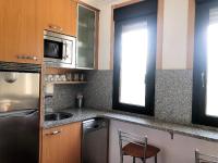 Kuchyň nebo kuchyňský kout v ubytování Apartamentos aDoniña Playa Major Sanxenxo