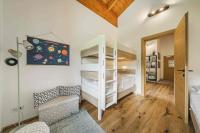 a room with two bunk beds and a couch at Dachstein West Apartment T4 in Russbach am Pass Gschütt