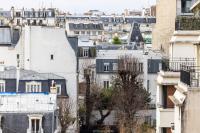 a view of the roofs of buildings at Hôtel Toujours &amp; Spa in Paris