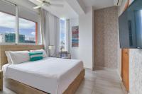 Postel nebo postele na pokoji v ubytování N1001 Gran vista Downtown Santo Domingo RD