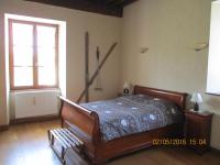 a bedroom with a bed and a window at Appartement La petite Résie in La Résie-Saint-Martin