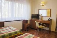 Televízia a/alebo spoločenská miestnosť v ubytovaní Hotel Skaut