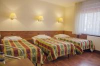 Posteľ alebo postele v izbe v ubytovaní Hotel Skaut