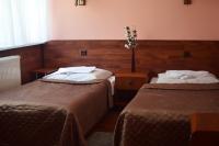 Posteľ alebo postele v izbe v ubytovaní Hotel Skaut