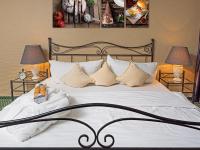 a bedroom with a large bed with white sheets and pillows at Hotel Rhyhof in Frauenfeld